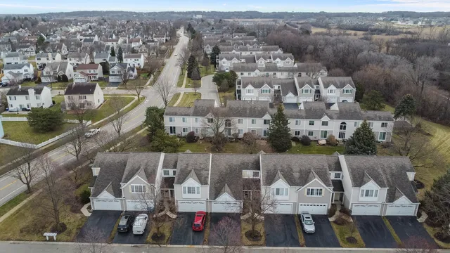an aerial view of houses with outdoor space