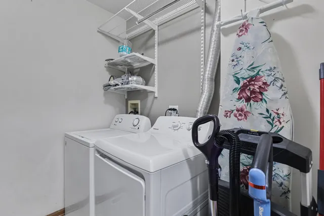 a bathroom with a sink mirror and vanity