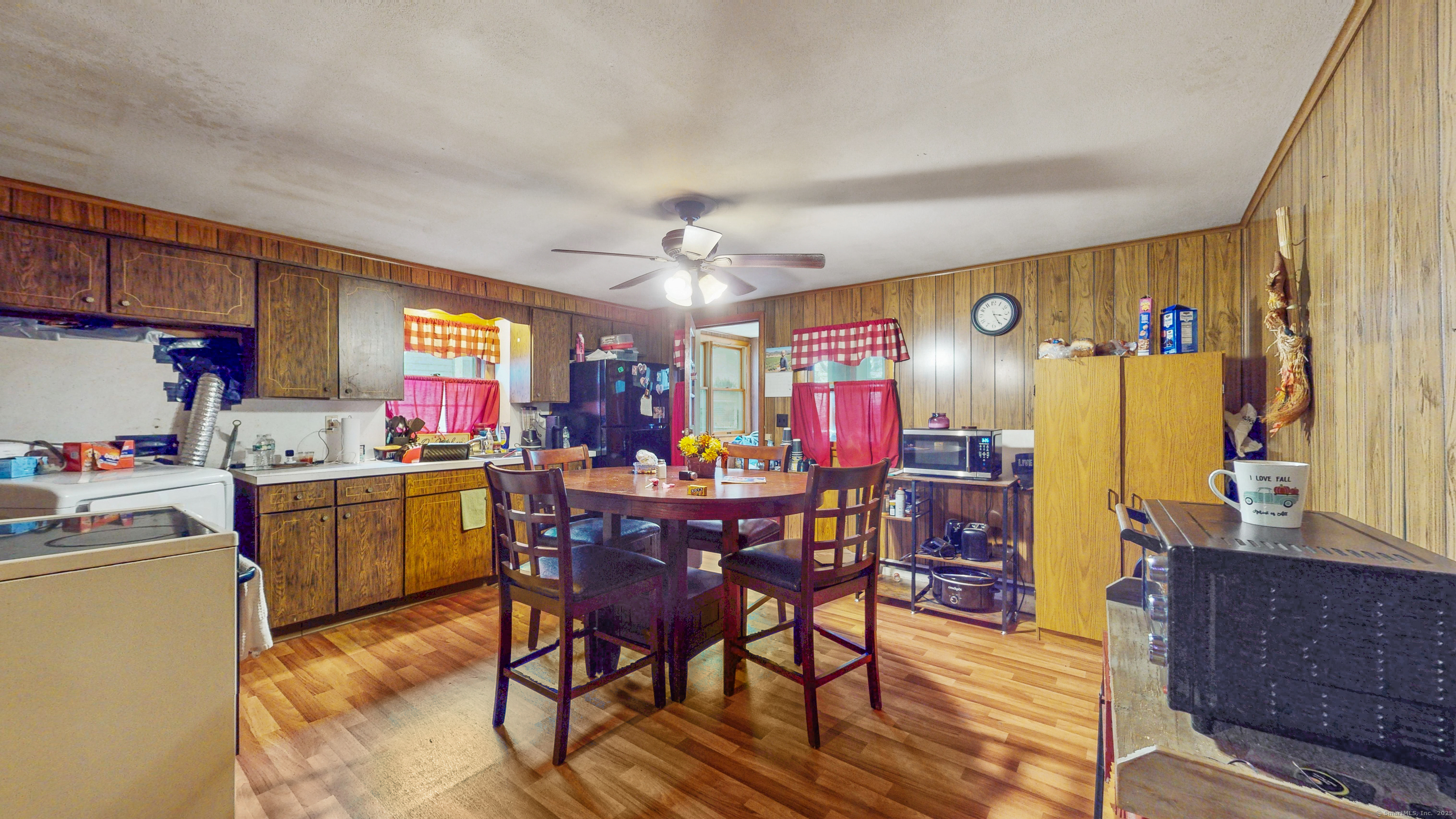 62 Rosemount Avenue Waterbury, CT 06708 - Photo 16 of 20 a view of dining room and kitchen with furniture window and wooden floor