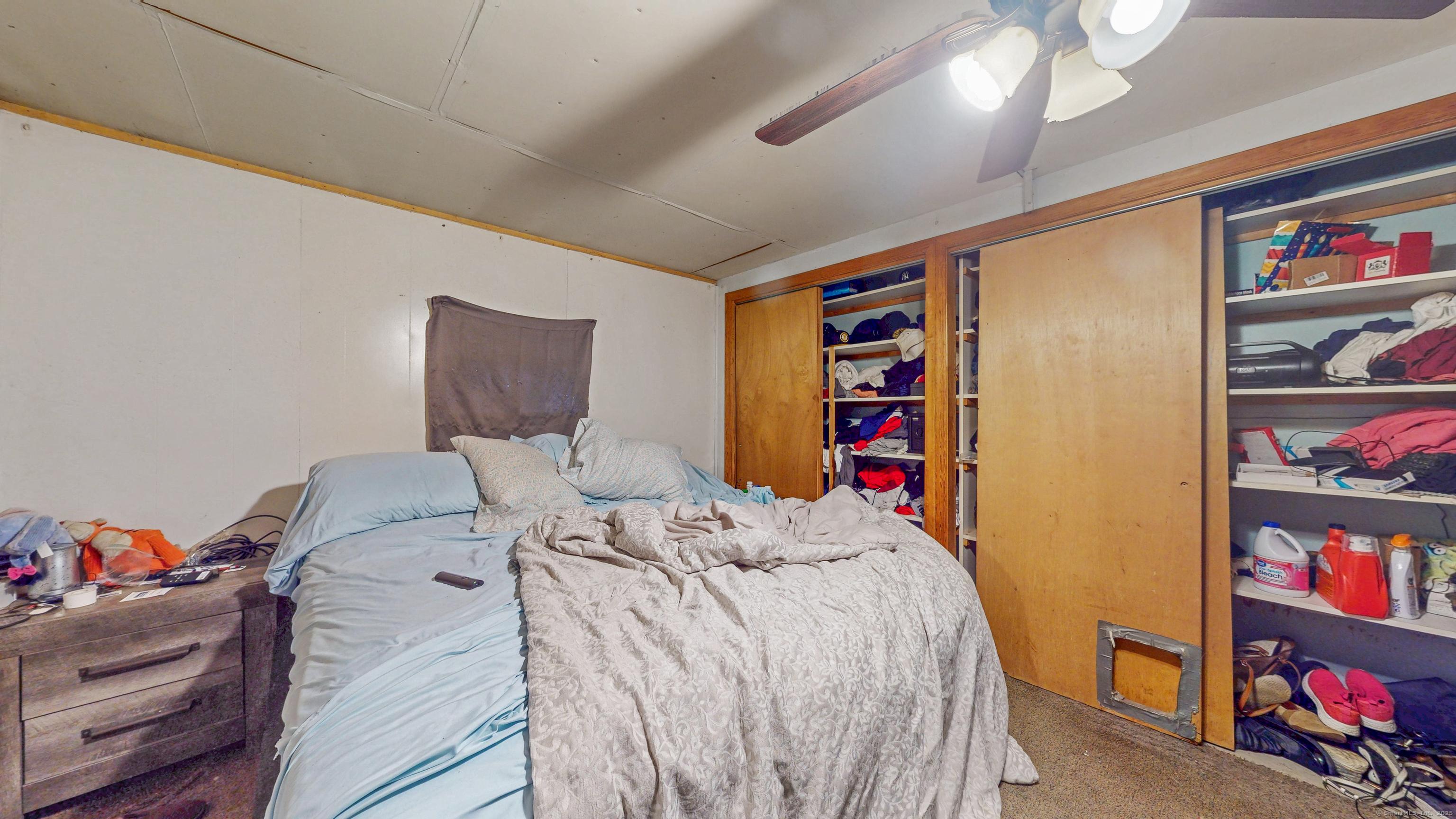 62 Rosemount Avenue Waterbury, CT 06708 - Photo 20 of 20 a bed sitting in a bedroom next to a book shelf