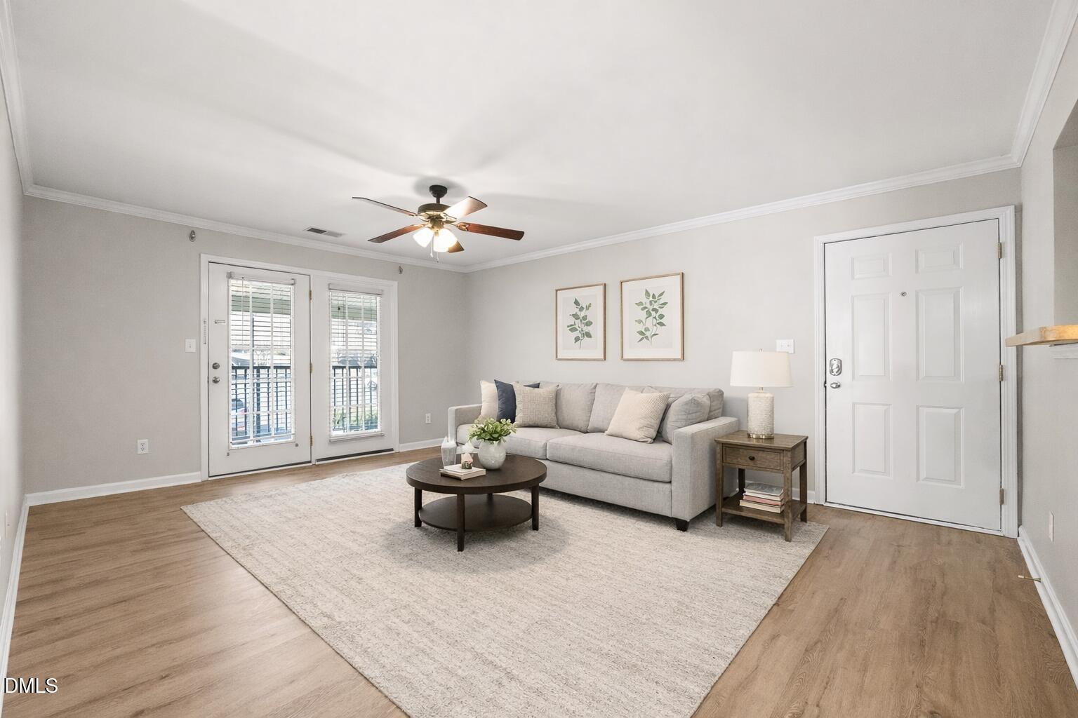 2304 Myron Drive, Unit 202 Raleigh, NC 27607 - Photo 4 of 31 Cozy living room with neutral tones