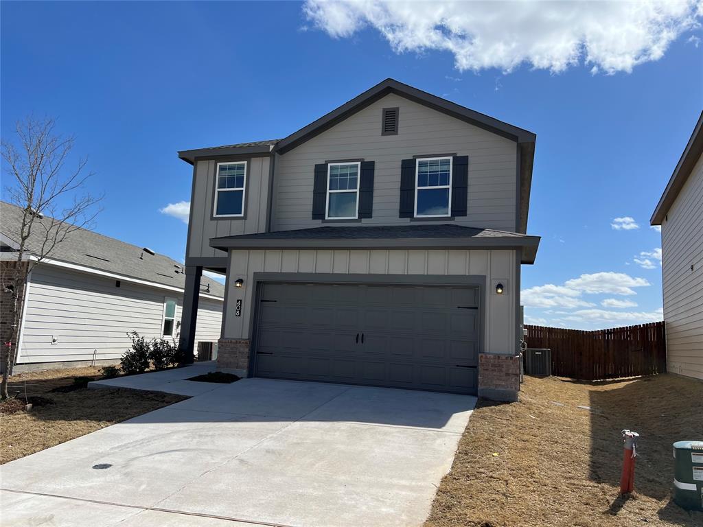 a front view of a house with a garage