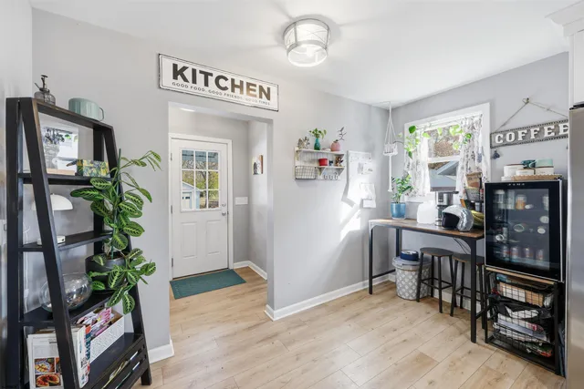 a view of a livingroom with furniture and a potted plant