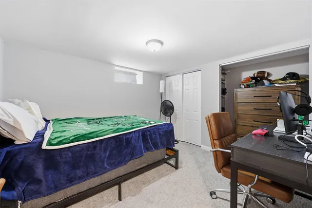 a view of a room with furniture and wooden floor