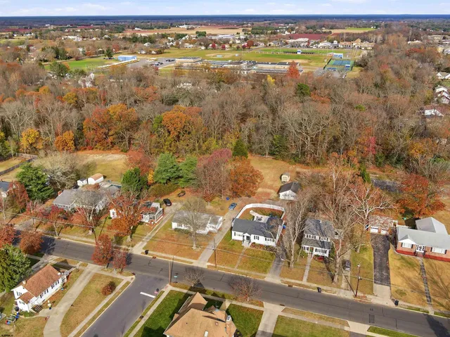 an aerial view of residential building with parking