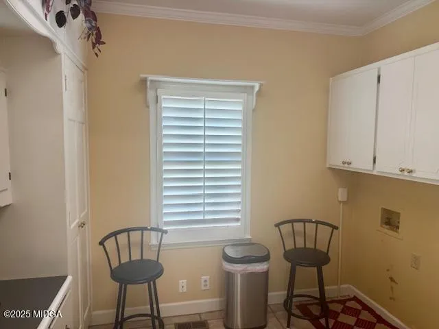 a view of a room that has a bench and chair