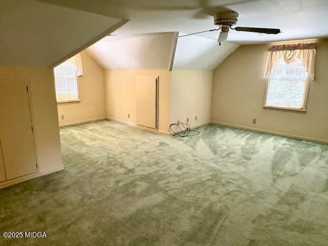 a view of an empty room and a window