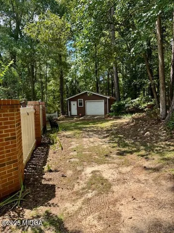 a house view with a backyard space