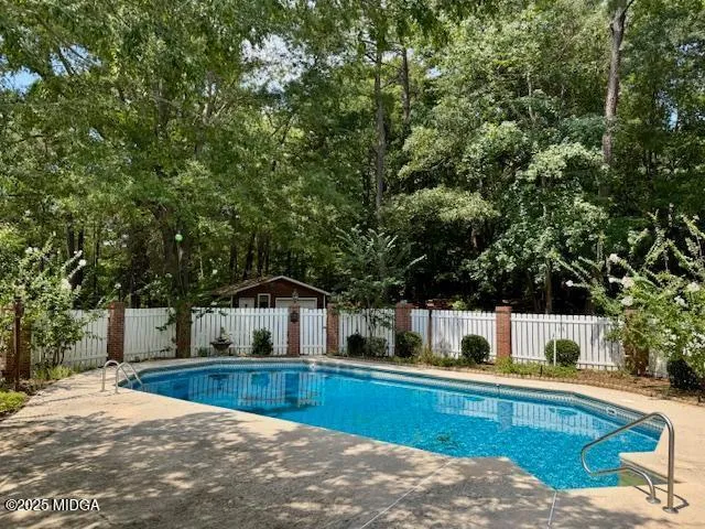 a view of house with outdoor space and sitting area