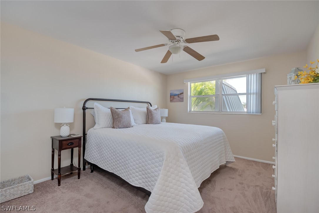 6777 Winkler Road, Unit 237 Fort Myers, FL 33919 - Photo 12 of 23 a bedroom with a bed and window