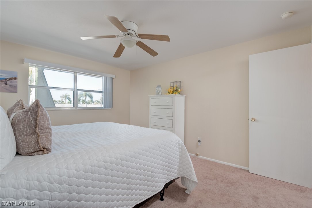 6777 Winkler Road, Unit 237 Fort Myers, FL 33919 - Photo 13 of 23 a bedroom with a bed and a window