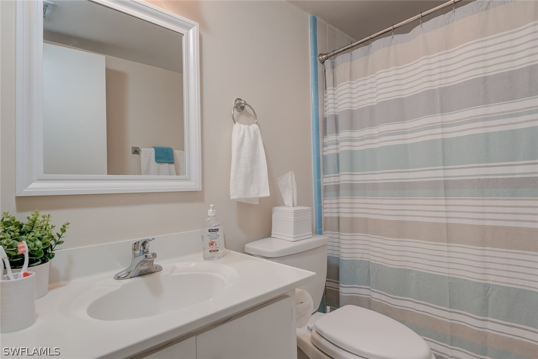 6777 Winkler Road, Unit 237 Fort Myers, FL 33919 - Photo 15 of 23 a bathroom with a sink toilet and shower