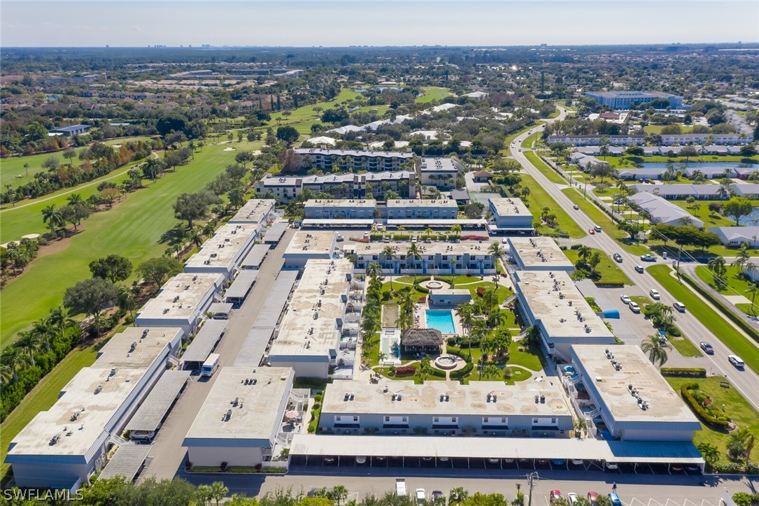 6777 Winkler Road, Unit 237 Fort Myers, FL 33919 - Photo 18 of 23 an aerial view of residential houses with outdoor space