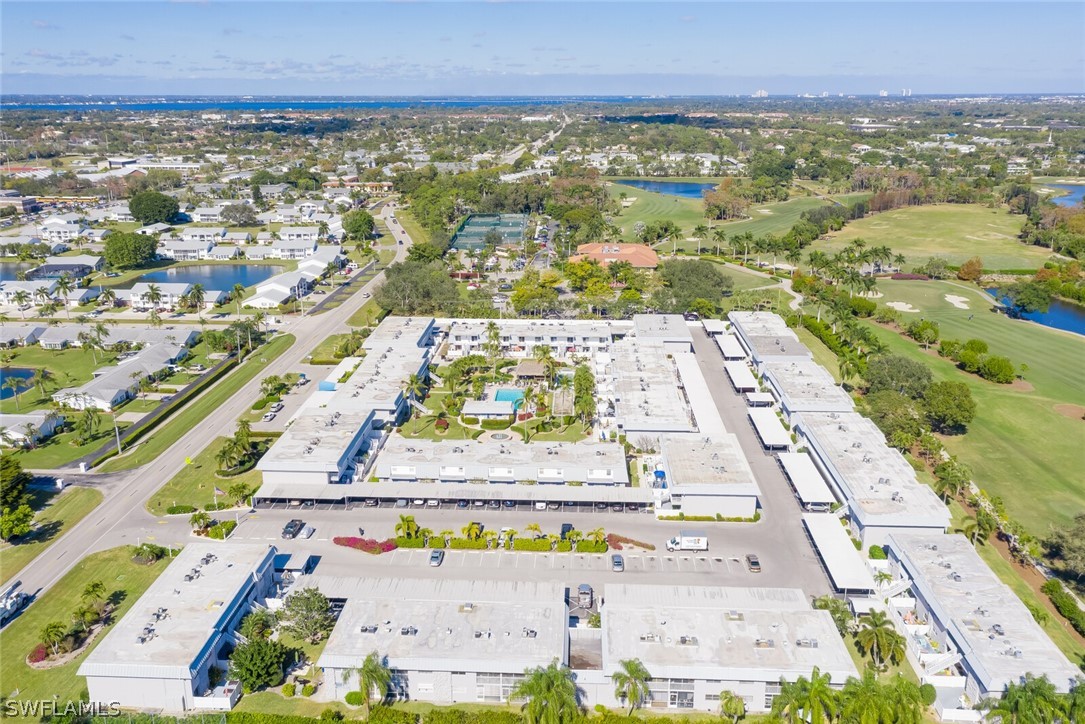 6777 Winkler Road, Unit 237 Fort Myers, FL 33919 - Photo 20 of 23 an aerial view of residential houses with outdoor space