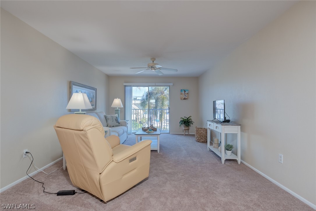 6777 Winkler Road, Unit 237 Fort Myers, FL 33919 - Photo 3 of 23 a living room with furniture and a window