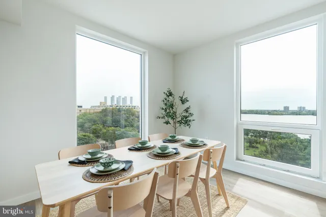 a dining room with furniture window and outdoor view