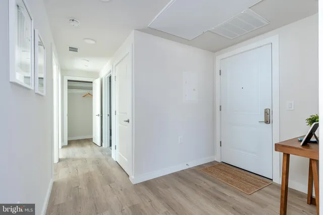 a view of a hallway with washer and dryer
