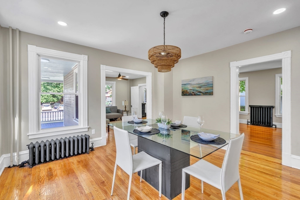 31 Park Street Northampton, MA 01062 - Photo 11 of 40 a dining room with furniture a chandelier and wooden floor