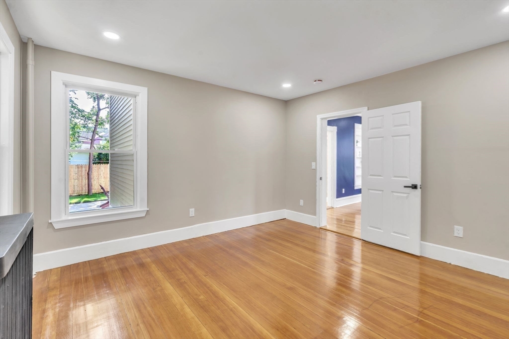 31 Park Street Northampton, MA 01062 - Photo 13 of 40 a view of an empty room with wooden floor and a window