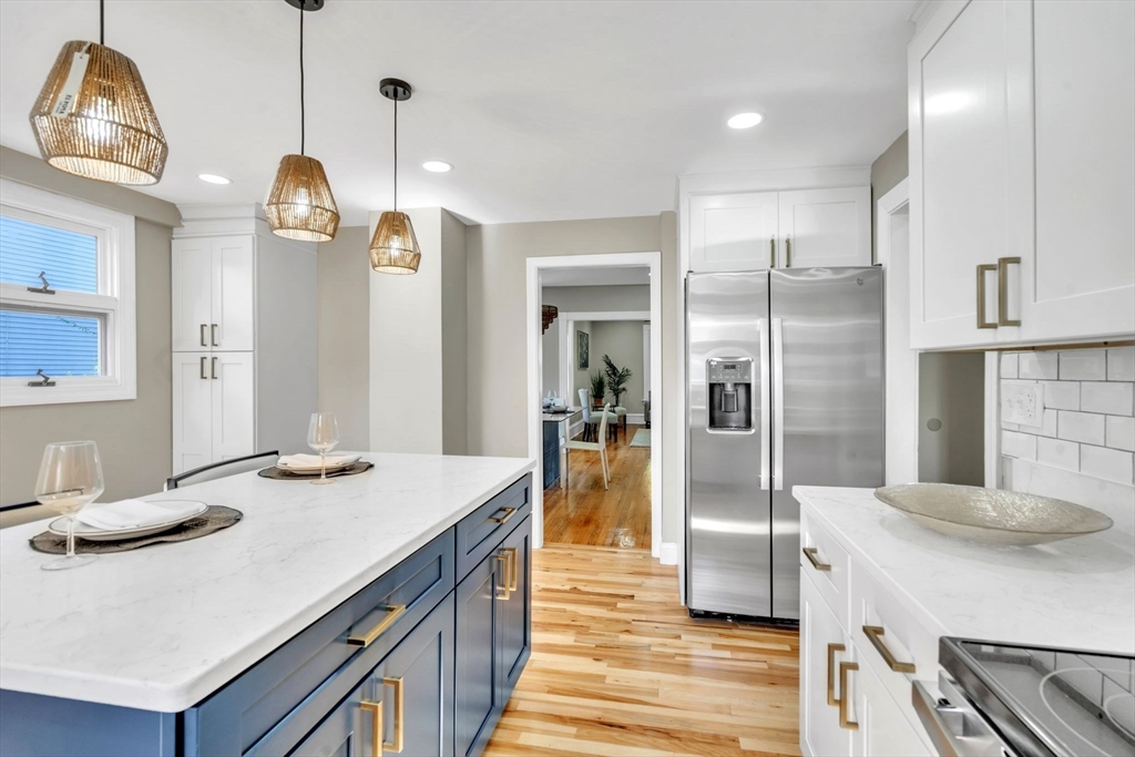 31 Park Street Northampton, MA 01062 - Photo 16 of 40 a kitchen with stainless steel appliances granite countertop a sink a refrigerator and a stove