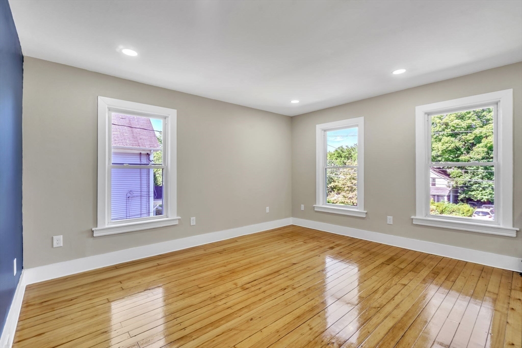 31 Park Street Northampton, MA 01062 - Photo 20 of 40 an empty room with wooden floor and windows