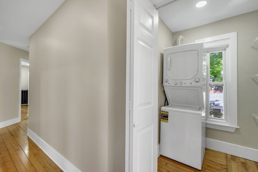 31 Park Street Northampton, MA 01062 - Photo 23 of 40 a hallway with painting on the wall and a window