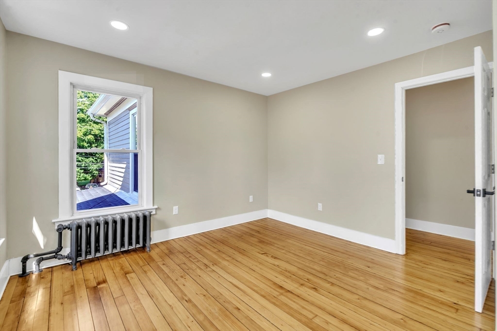 31 Park Street Northampton, MA 01062 - Photo 24 of 40 a view of an empty room with wooden floor and a window