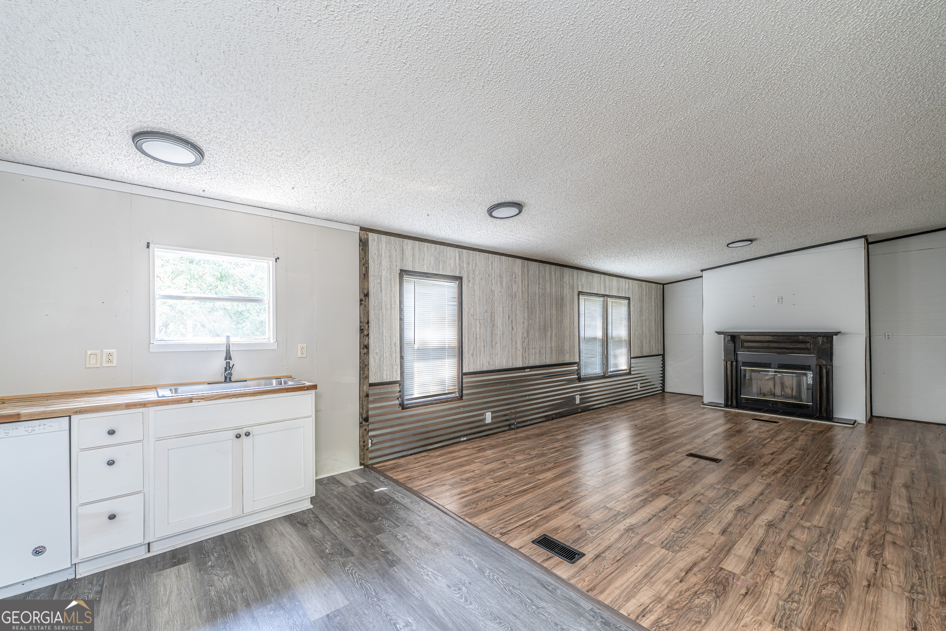 71 Kirk Road Northwest White, GA 30184 - Photo 12 of 43 a view of an empty room with window and wooden floor