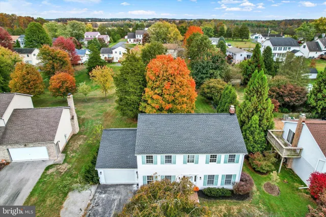 an aerial view of a house with a garden