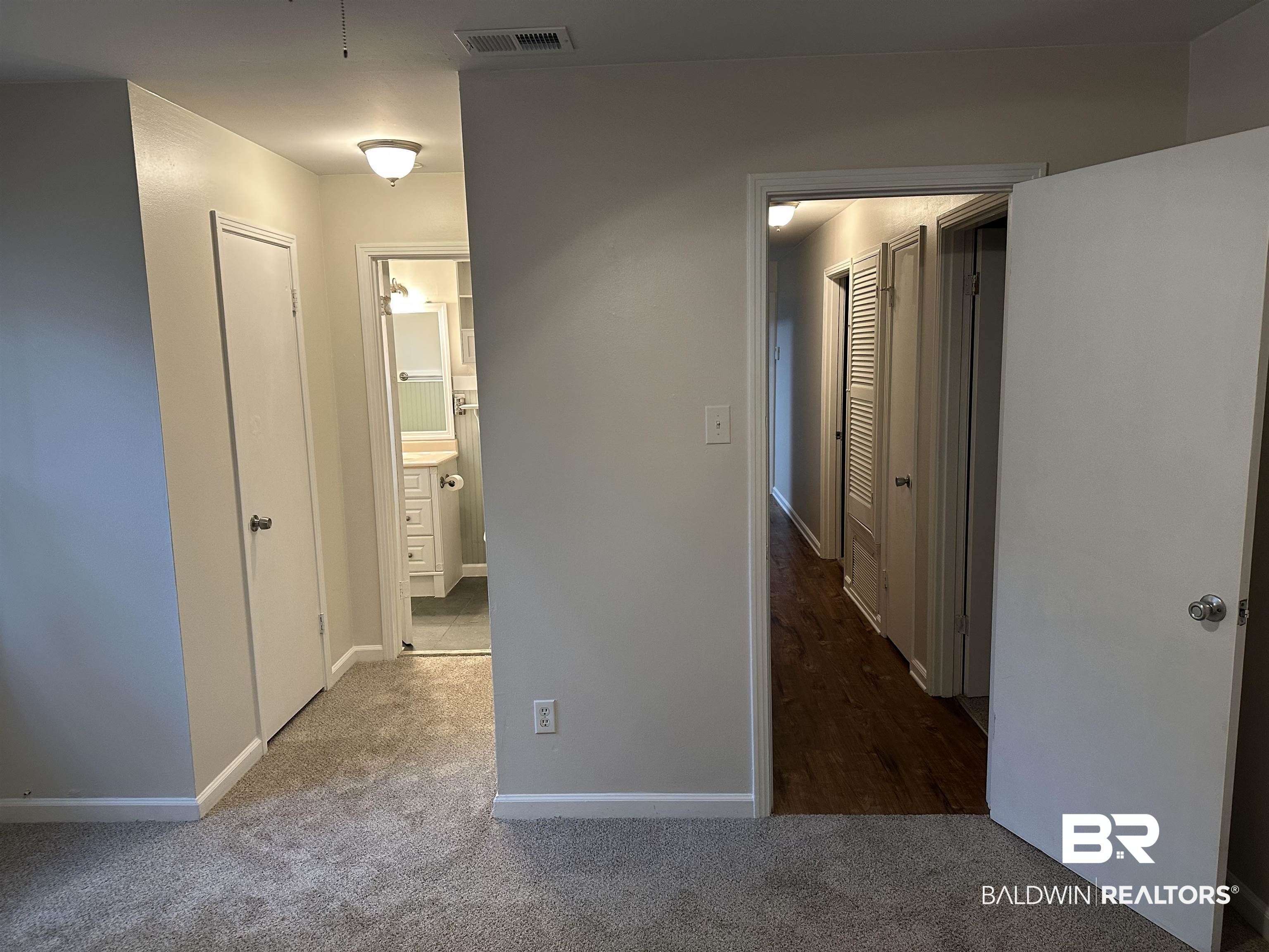 104 Vanderbilt Drive Mobile, AL 36608 - Photo 52 of 52 Hallway featuring dark colored carpet