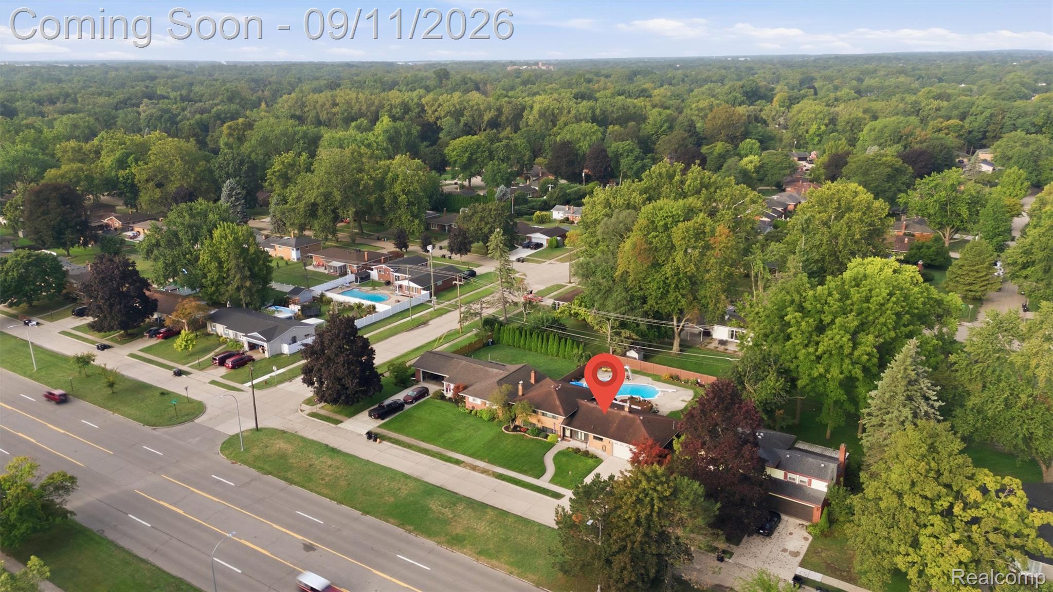 16799 Farmington Road Livonia, MI 48154 - Photo 65 of 71 Expansive property featuring a mature treed landscape, a private swimming pool, and a paved road frontage