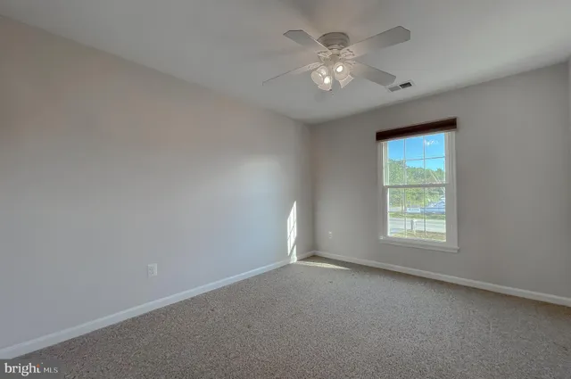 a bathroom with a sink toilet and mirror