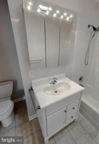 a view of a balcony with wooden floor and fence