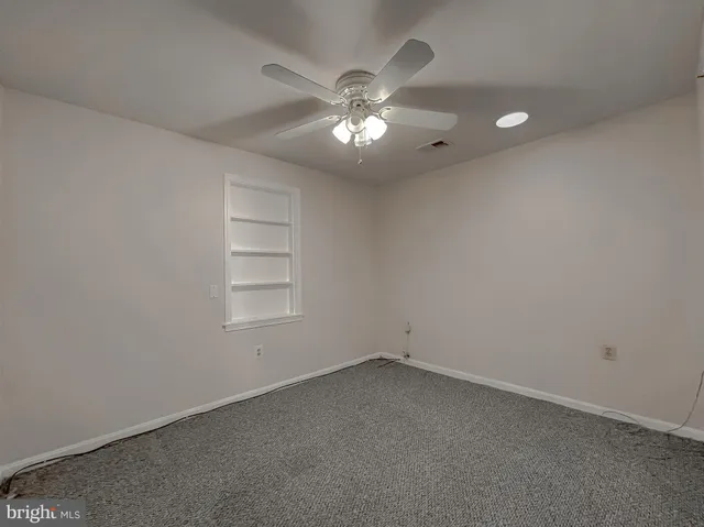 a view of a chairs and table in the backyard