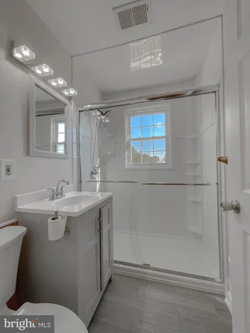 a view of a swimming pool with an outdoor seating