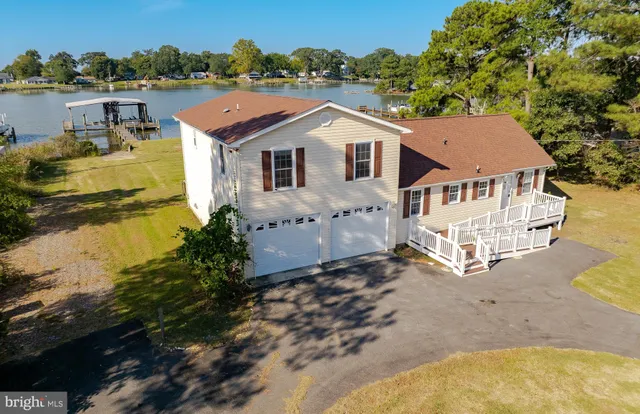 a kitchen with granite countertop a sink stainless steel appliances and cabinets