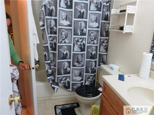 291 Rector Street Perth Amboy, NJ 08861 - Photo 11 of 15 a bathroom with a sink toilet and shower