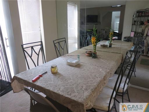 291 Rector Street Perth Amboy, NJ 08861 - Photo 14 of 15 a dining room with furniture and a potted plant