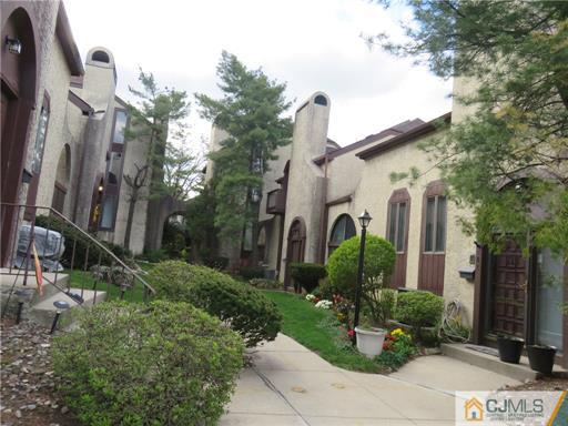 291 Rector Street Perth Amboy, NJ 08861 - Photo 3 of 15 a front view of a house with garden