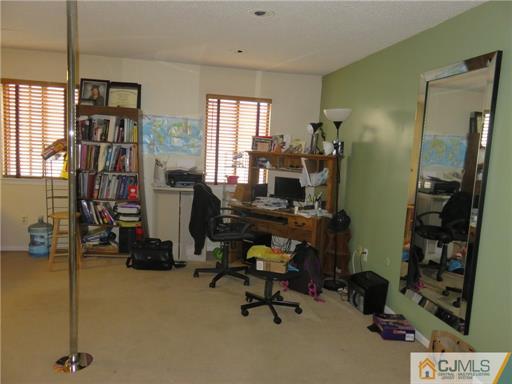 291 Rector Street Perth Amboy, NJ 08861 - Photo 6 of 15 a view of a workspace with gym equipment