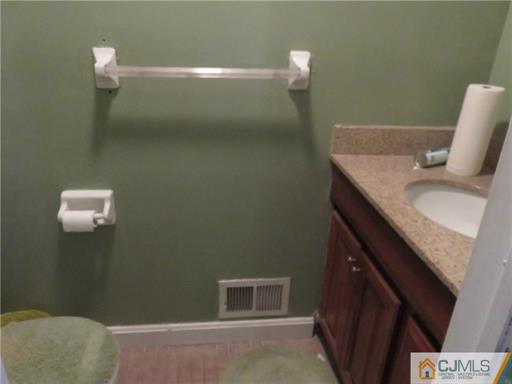 291 Rector Street Perth Amboy, NJ 08861 - Photo 8 of 15 a bathroom with a sink and a mirror