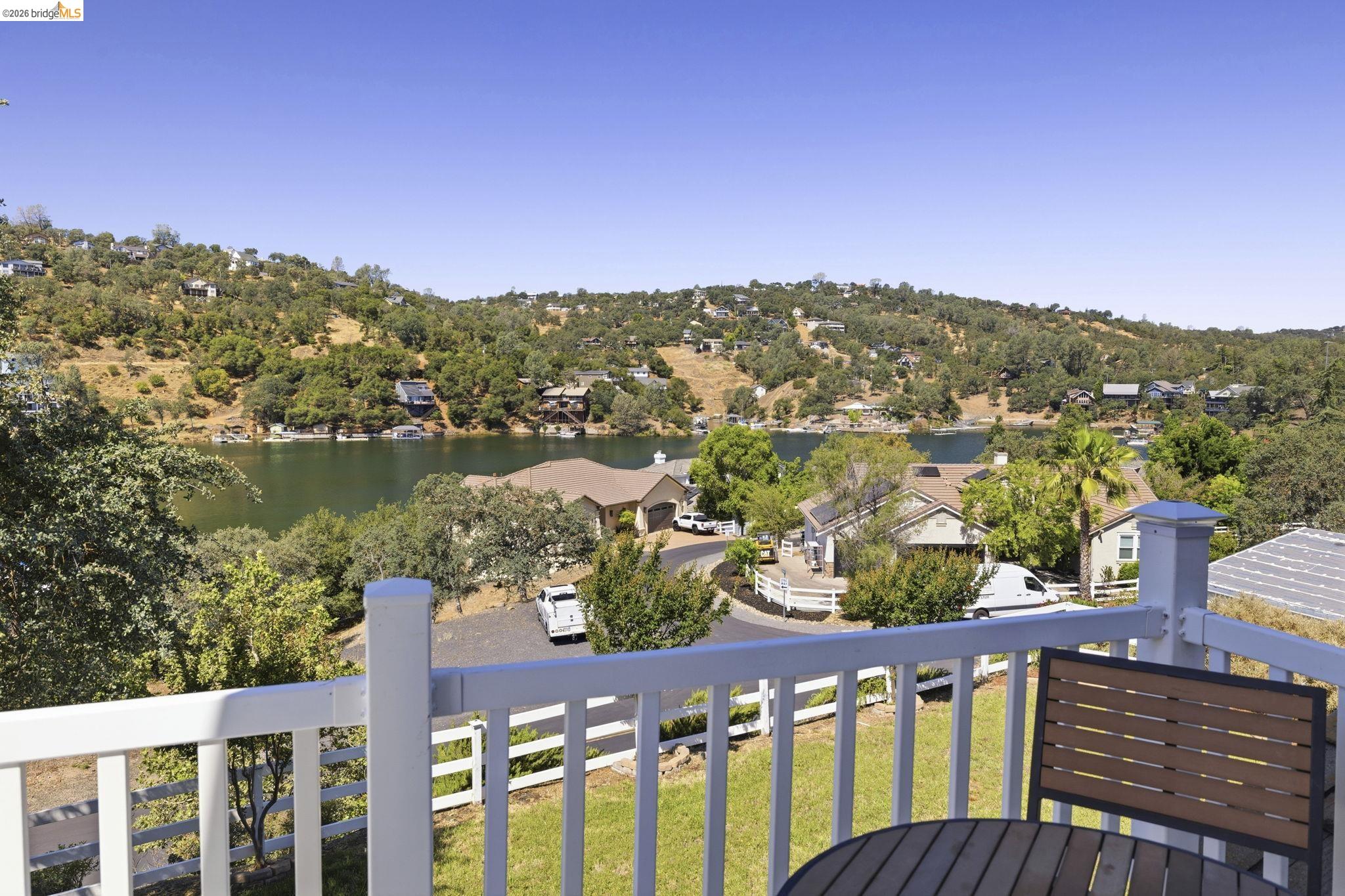 6242 Bluff View Road Copperopolis, CA 95228 - Photo 39 of 59 Expansive water views and hillside scenery from the primary bedroom balcony