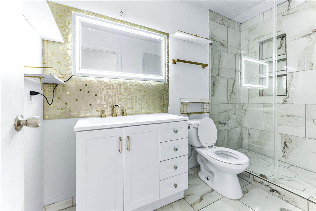 1220 Haley Place College Station, TX 77845 - Photo 19 of 20 a bathroom with a sink toilet and shower