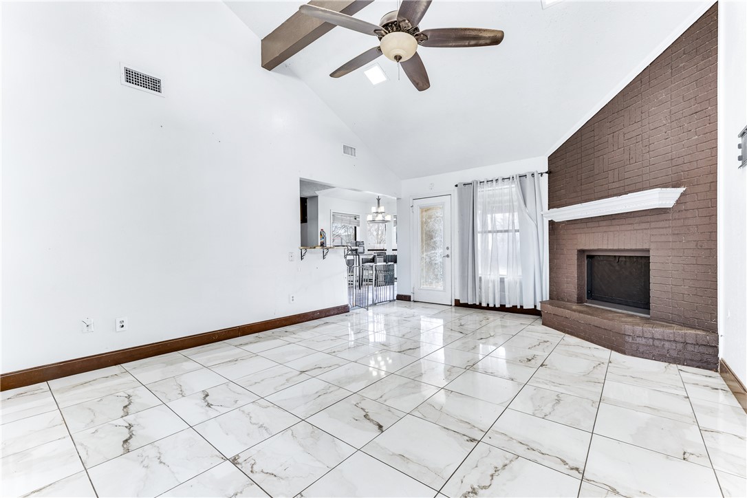 1220 Haley Place College Station, TX 77845 - Photo 2 of 20 a view of empty room with cabinet and fireplace