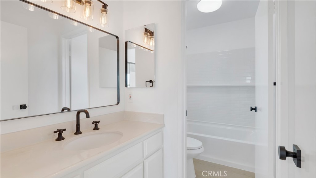 336 Fallingstar Irvine, CA 92614 - Photo 29 of 73 a bathroom with a sink and a mirror