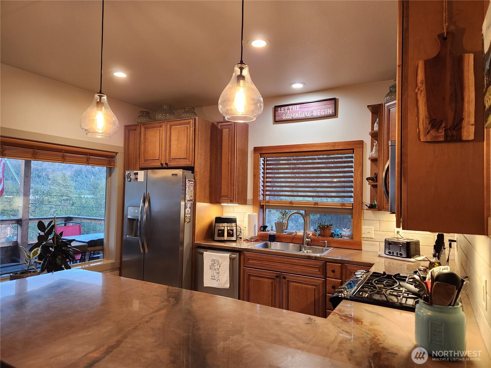 1054 Lower Madison Street Republic, WA 99166 - Photo 3 of 19 a kitchen with stainless steel appliances granite countertop a refrigerator and a stove