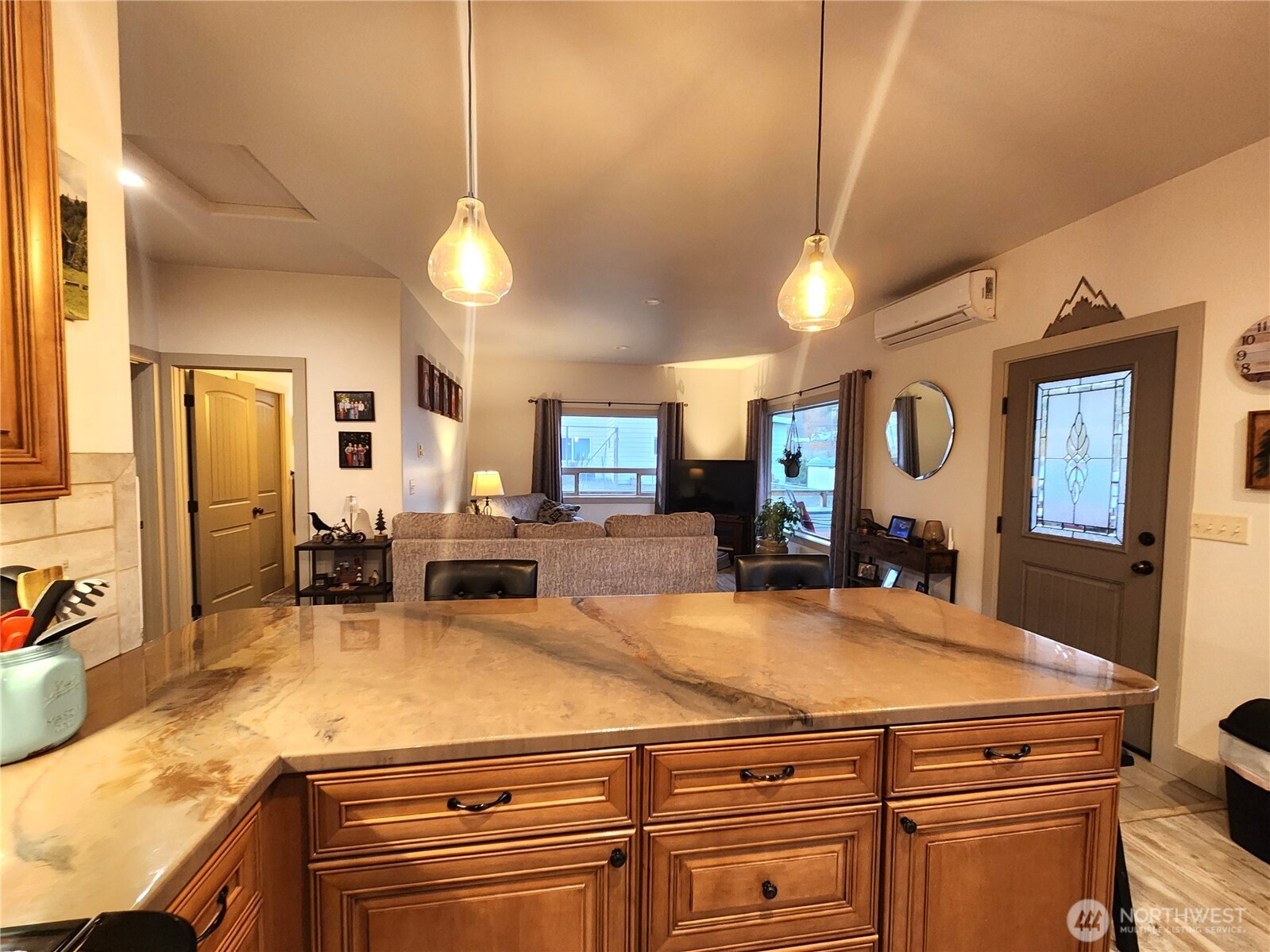 1054 Lower Madison Street Republic, WA 99166 - Photo 4 of 19 a room with kitchen island a large counter space and stainless steel appliances