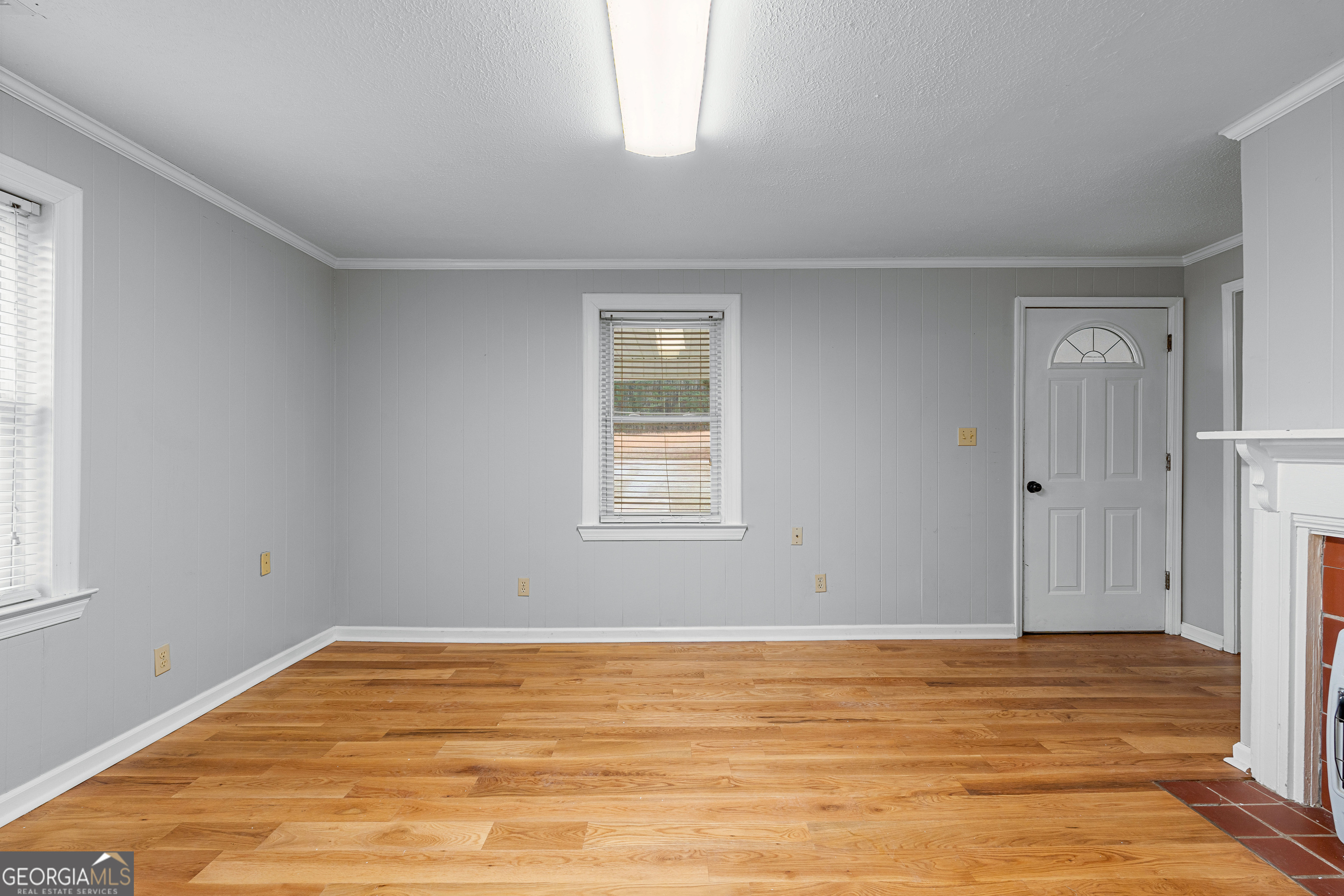 1330 Dunn Road Molena, GA 30258 - Photo 14 of 56 a view of an empty room with wooden floor and a window