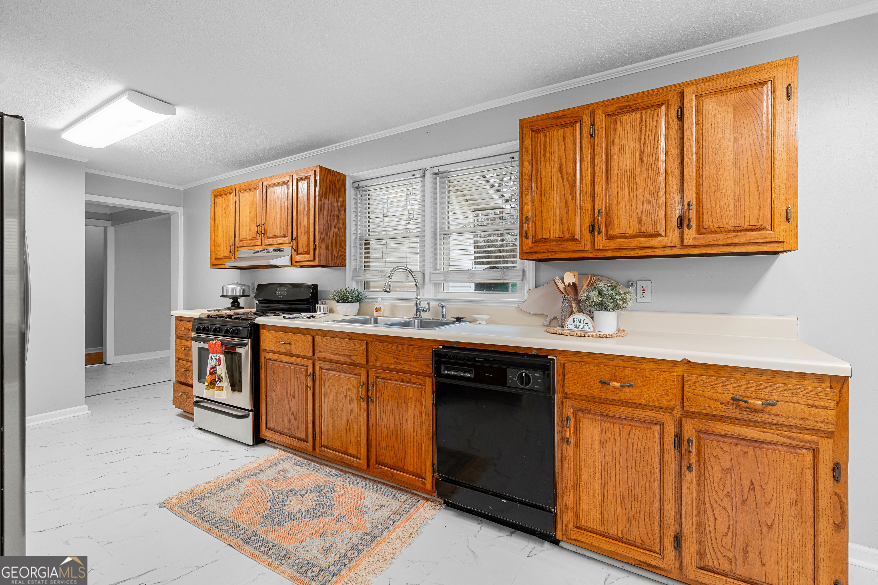 1330 Dunn Road Molena, GA 30258 - Photo 21 of 56 a kitchen with stainless steel appliances granite countertop a stove a sink and a microwave
