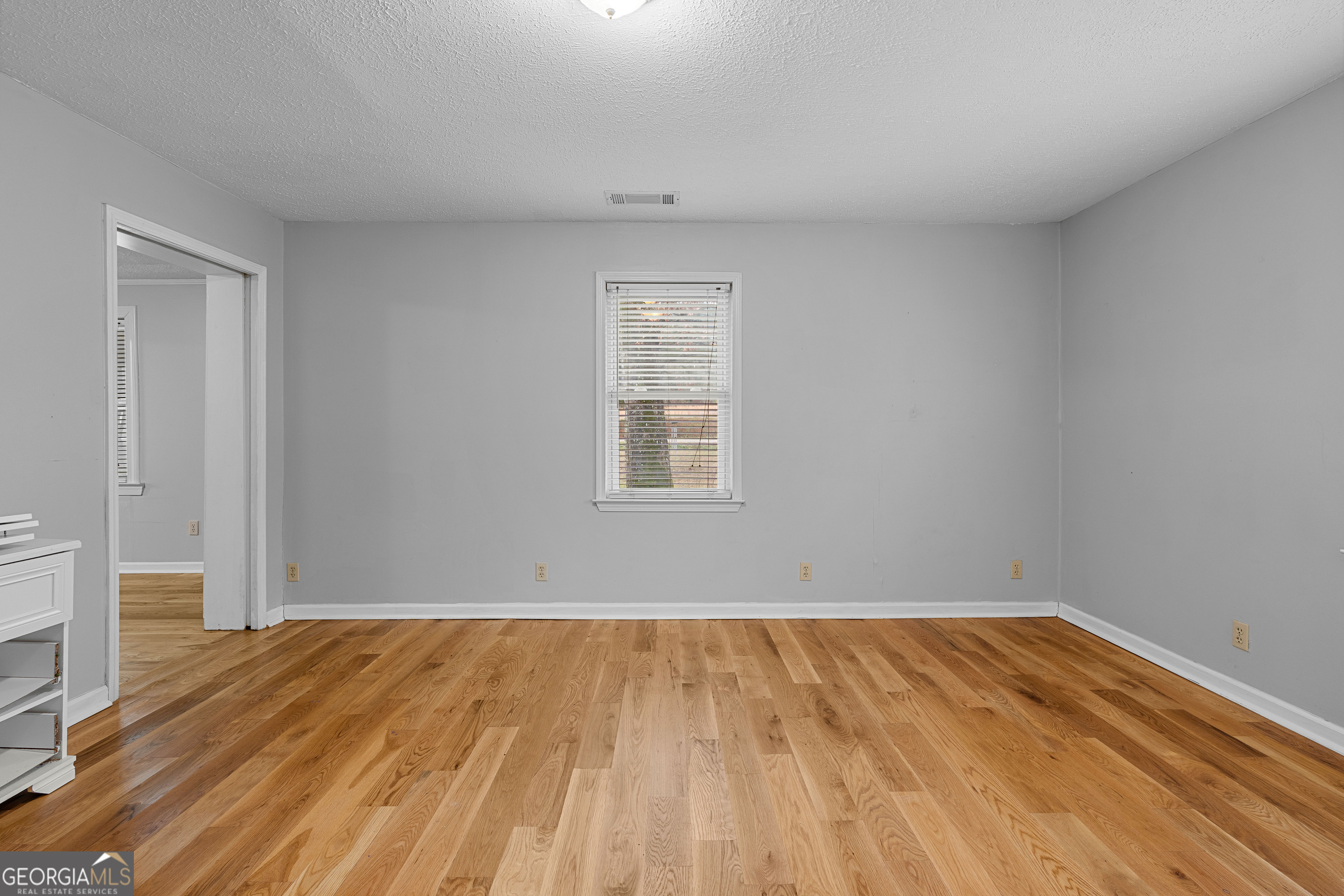 1330 Dunn Road Molena, GA 30258 - Photo 30 of 56 a view of a room with wooden floor and a window